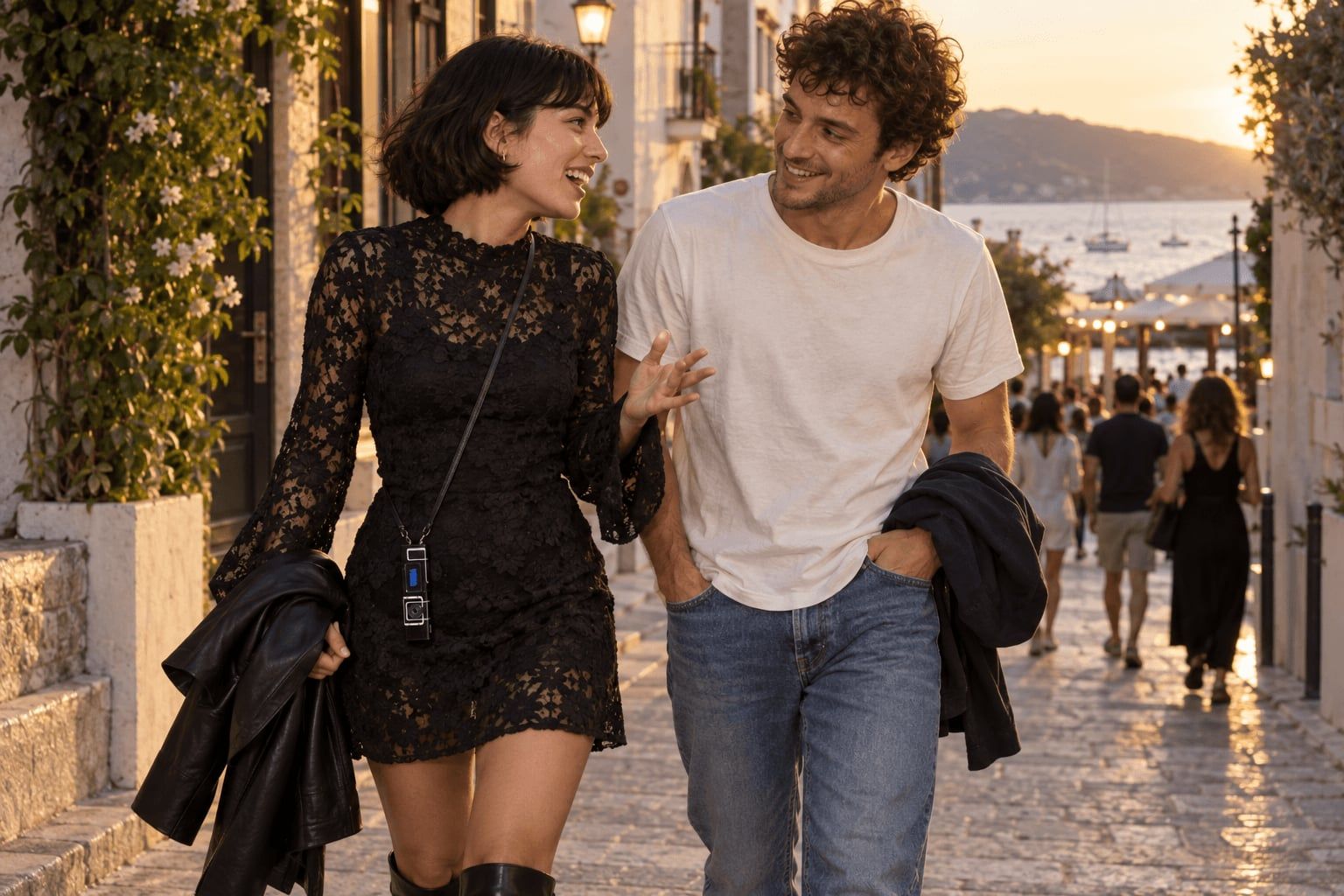 Two people walk together in evening sunlight, one wearing a small Nokia on a cross-body cord.